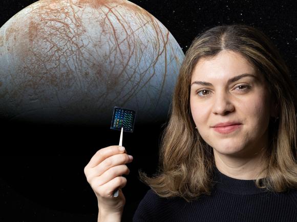 Composite image of Europa behind Azadeh Ansari holding a computer chip that combines many sensors into one small package.