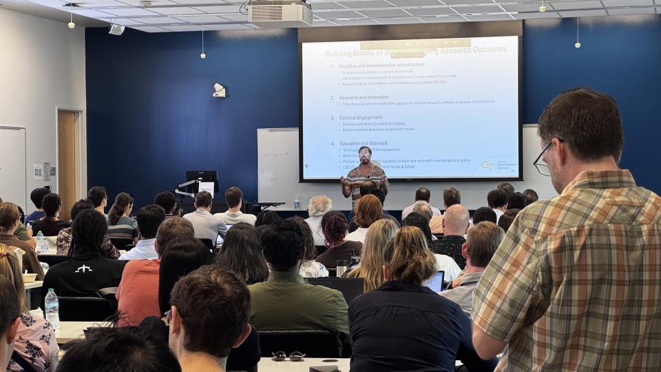 Executive Director Jud Ready presenting inside a room at the Marcus Nanotechnology Building for SRI&#039;s inaugural meeting.
